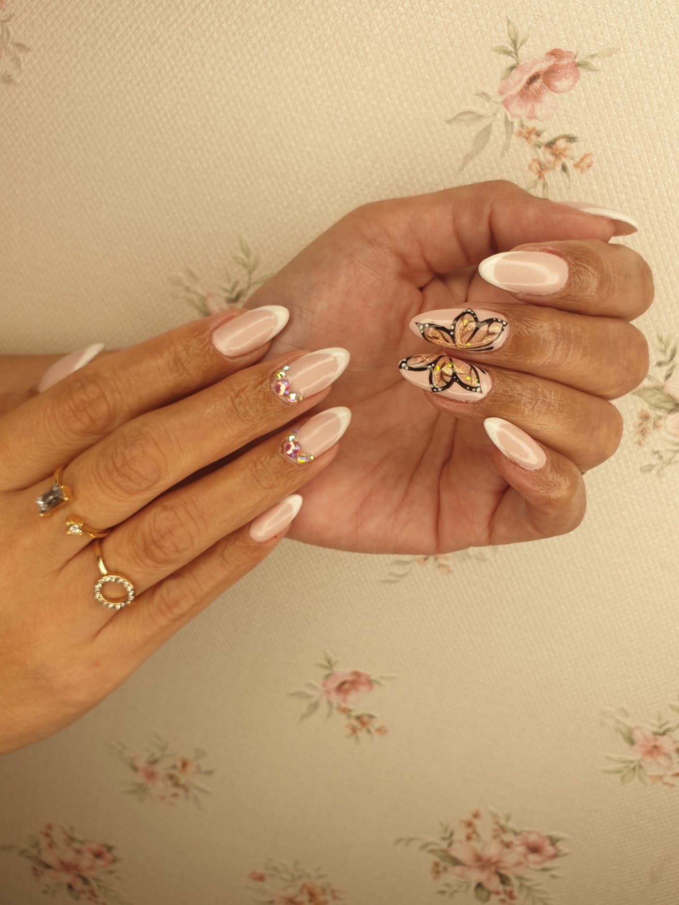Nude almond nails with butterfly art
